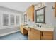 Bathroom with dual vanities, modern fixtures, and a large window at 79 Tidy Island Blvd, Bradenton, FL 34210