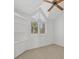 Bedroom featuring plantation shutters and built-in shelving at 79 Tidy Island Blvd, Bradenton, FL 34210