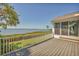 Enjoy panoramic waterfront views from this outdoor deck with access to the interior at 79 Tidy Island Blvd, Bradenton, FL 34210