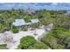 Single Gathering home with sandy yard, wood deck and lush landscaping at 79 Tidy Island Blvd, Bradenton, FL 34210
