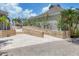 Clubhouse exterior showcasing brickwork, vibrant flowers, and a smooth transition to the upper level at 79 Tidy Island Blvd, Bradenton, FL 34210