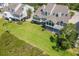 Expansive waterfront home with a large yard, porch, and beautiful lawn at 79 Tidy Island Blvd, Bradenton, FL 34210