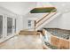 Bright foyer features tile floors, a staircase, and a pebble water feature at 79 Tidy Island Blvd, Bradenton, FL 34210