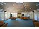 Bright room featuring vaulted ceilings, a brick fireplace, and ample table seating perfect for gatherings at 79 Tidy Island Blvd, Bradenton, FL 34210