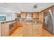 Well-equipped kitchen offers granite countertops, stainless steel appliances, and a center island at 79 Tidy Island Blvd, Bradenton, FL 34210