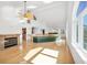 Bright living room features high vaulted ceilings, fireplace, and large windows with natural light at 79 Tidy Island Blvd, Bradenton, FL 34210