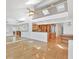 Bright living room with wood floors, high ceilings, and views into the kitchen at 79 Tidy Island Blvd, Bradenton, FL 34210