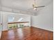 Bright and airy living room with hardwood floors, skylights, and a stylish ceiling fan at 79 Tidy Island Blvd, Bradenton, FL 34210