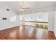 Inviting living room with hardwood floors, skylights, and a modern ceiling fan at 79 Tidy Island Blvd, Bradenton, FL 34210
