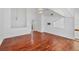 Open-concept living room with hardwood floors and a modern ceiling fan at 79 Tidy Island Blvd, Bradenton, FL 34210