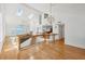 Bright living room boasts skylights, modern chandelier, and staircase with glass railings at 79 Tidy Island Blvd, Bradenton, FL 34210