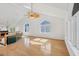 Light-filled living room with hardwood floors, skylight, and large windows at 79 Tidy Island Blvd, Bradenton, FL 34210