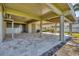 Spacious tiled patio area below the home with waterfront access at 79 Tidy Island Blvd, Bradenton, FL 34210