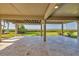 Covered patio with tiled flooring overlooks lush greenery and waterfront at 79 Tidy Island Blvd, Bradenton, FL 34210