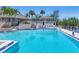 Swimming pool with chairs and umbrella at 79 Tidy Island Blvd, Bradenton, FL 34210