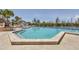 A clear blue swimming pool with a shallow end and a gazebo in the background at 79 Tidy Island Blvd, Bradenton, FL 34210