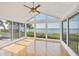 Bright sunroom with floor-to-ceiling windows with a water view at 79 Tidy Island Blvd, Bradenton, FL 34210