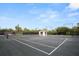Well-maintained tennis courts with a shaded gazebo, surrounded by lush greenery at 79 Tidy Island Blvd, Bradenton, FL 34210