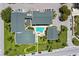 Aerial view of condo with courtyard, pool, and lush landscaping, offering a serene oasis at 845 Benjamin Franklin Dr # 101, Sarasota, FL 34236
