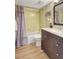 Bathroom featuring a shower-tub combo, modern vanity, and neutral paint at 845 Benjamin Franklin Dr # 101, Sarasota, FL 34236