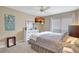 Serene bedroom with a large bed, natural light, and modern decor for ultimate relaxation at 845 Benjamin Franklin Dr # 101, Sarasota, FL 34236