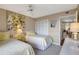 Cozy bedroom featuring twin beds, bright decor, and a calming atmosphere for restful nights at 845 Benjamin Franklin Dr # 101, Sarasota, FL 34236