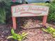 Lido Presidential sign at the entrance of the Lido Presidential neighborhood with garden foliage at 845 Benjamin Franklin Dr # 101, Sarasota, FL 34236