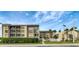 Low rise condo building with well-kept exterior and balconies in a well-maintained residential area at 845 Benjamin Franklin Dr # 101, Sarasota, FL 34236