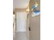 Entryway featuring closet, coat rack, and beach-themed decor for a welcoming coastal vibe at 845 Benjamin Franklin Dr # 101, Sarasota, FL 34236