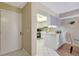 Inviting view of the kitchen showcasing white cabinets and stainless steel appliances at 845 Benjamin Franklin Dr # 101, Sarasota, FL 34236