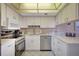 Updated kitchen with stainless steel appliances and white cabinets provides ample storage at 845 Benjamin Franklin Dr # 101, Sarasota, FL 34236