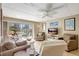 Inviting living room with sliding glass doors revealing a pool view and outdoor seating area at 845 Benjamin Franklin Dr # 101, Sarasota, FL 34236