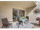 Charming patio with views into the condo interior and decorated with a sun at 845 Benjamin Franklin Dr # 101, Sarasota, FL 34236