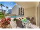 Comfortable patio featuring seating and tranquil poolside view, ideal for relaxing at 845 Benjamin Franklin Dr # 101, Sarasota, FL 34236