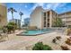 Inviting pool area surrounded by lush landscaping, providing a relaxing oasis at 845 Benjamin Franklin Dr # 101, Sarasota, FL 34236