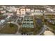 Aerial view of community shows tennis courts, a pond and downtown buildings in the background at 850 S Tamiami Trl # 529, Sarasota, FL 34236