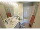 Clean bathroom with a white vanity, shower-tub combo, and coordinated towels, providing a functional space at 850 S Tamiami Trl # 529, Sarasota, FL 34236