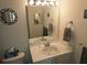 Bathroom featuring a sink, a large mirror, vanity lighting, and neutral wall color at 850 S Tamiami Trl # 529, Sarasota, FL 34236