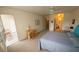 Bright bedroom with a ceiling fan, balcony access, and a desk space for work or study at 850 S Tamiami Trl # 529, Sarasota, FL 34236