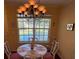 Traditional dining area with light walls and light colored table and chairs near large window at 850 S Tamiami Trl # 529, Sarasota, FL 34236