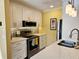 Well-lit kitchen with stainless steel appliances, modern backsplash, and white countertops at 850 S Tamiami Trl # 529, Sarasota, FL 34236