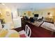 Open floor plan showing kitchen with bar, dining, and living room with dark wood floors at 850 S Tamiami Trl # 529, Sarasota, FL 34236