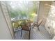 Screened patio with seating and views of the green landscape at 850 S Tamiami Trl # 529, Sarasota, FL 34236