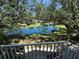Relaxing pond view with lush greenery from a private balcony provides tranquil scenery and natural beauty at 850 S Tamiami Trl # 529, Sarasota, FL 34236