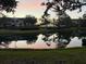 Scenic pond view at sunset showcases beautiful reflections and peaceful community ambiance at 850 S Tamiami Trl # 529, Sarasota, FL 34236