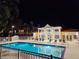 Night view of the pool with ample seating. Ideal for relaxation and entertaining at this community at 850 S Tamiami Trl # 529, Sarasota, FL 34236