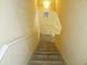Carpeted staircase leading to the upper level of the home at 850 S Tamiami Trl # 529, Sarasota, FL 34236
