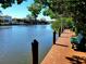 Community waterfront with wooden dock and benches offers scenic views of the water and surrounding landscape at 850 S Tamiami Trl # 529, Sarasota, FL 34236