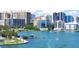Scenic waterfront view showcasing the cityscape with palm trees, piers, and boats along Sarasota Bay at 850 S Tamiami Trl # 529, Sarasota, FL 34236