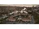 Aerial view of complex highlighting lush landscaping and community amenities at 850 S Tamiami Trl # 704, Sarasota, FL 34236